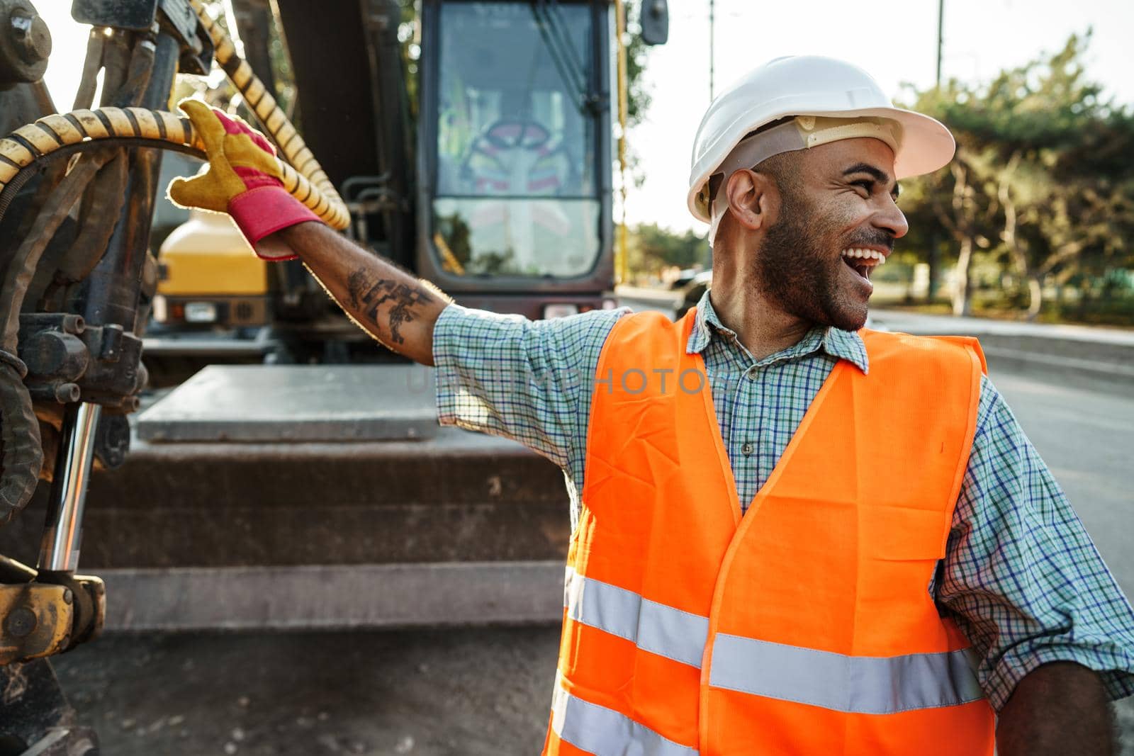 Portrait of young construction engineer wearing hardhat, close up