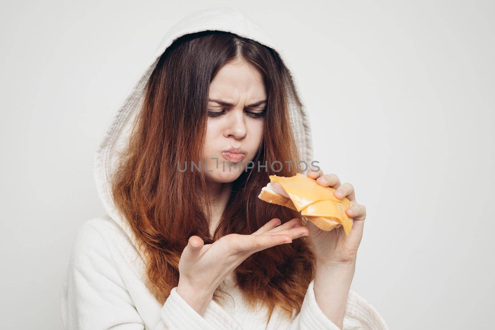 red-haired woman eating a sandwich snack lunch. High quality photo
