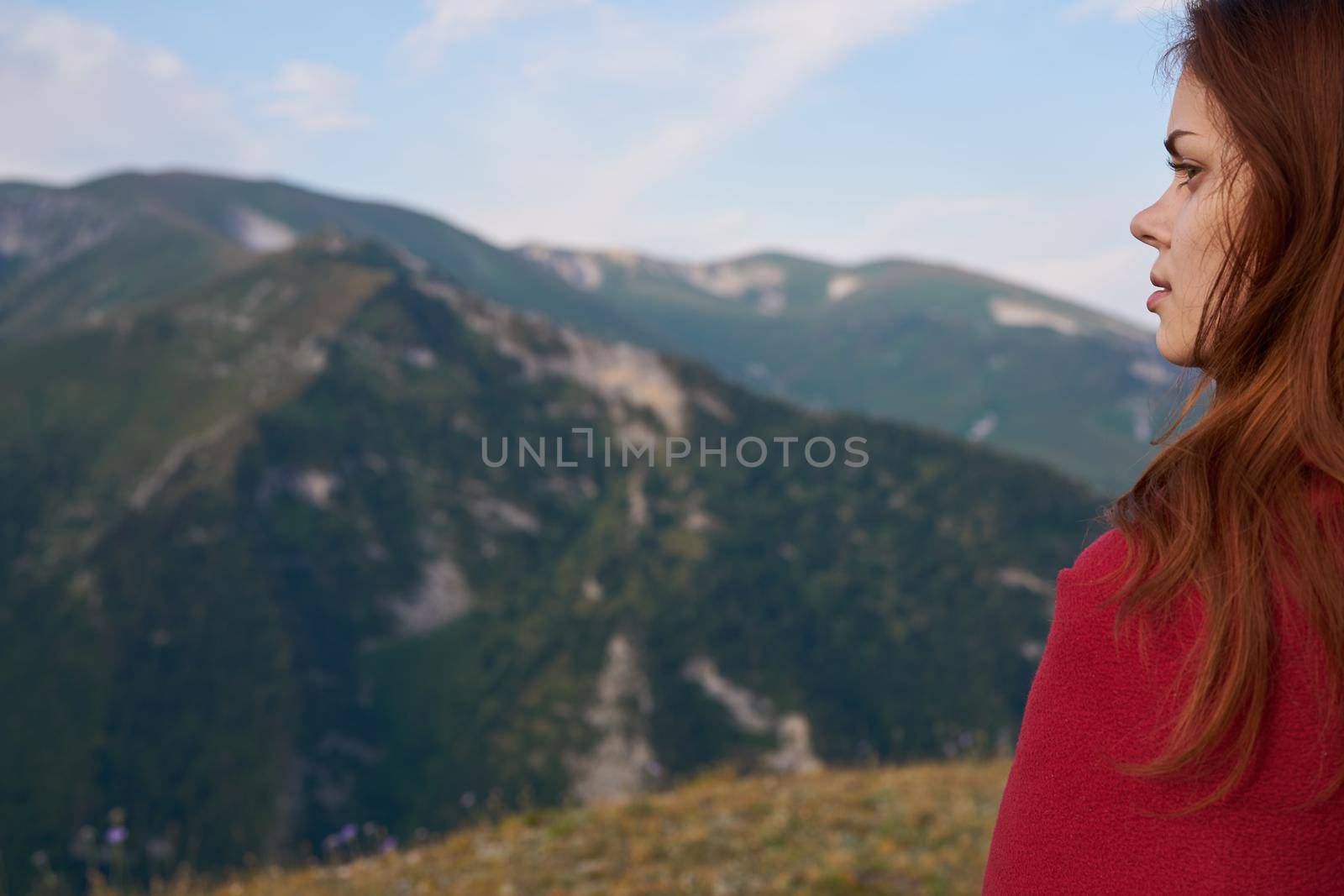 woman with red plaid on nature in the mountains vacation adventure. High quality photo
