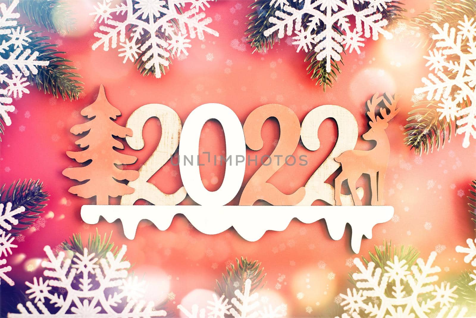 Red Christmas holidays background; greeting card , Christmas card with fir and decor on glitter background