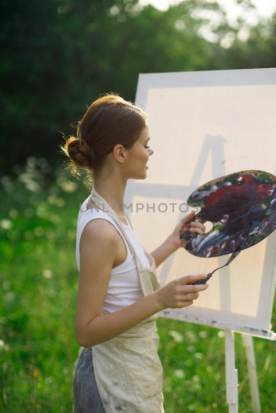 woman artist outdoors paint palette painting landscape by Vichizh