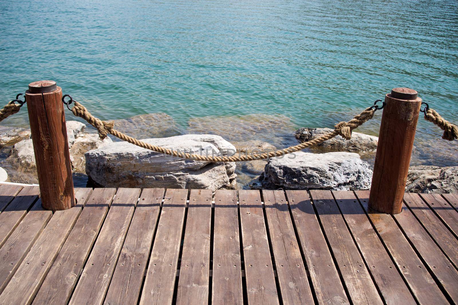 Empty wooden jetty on the lake shore