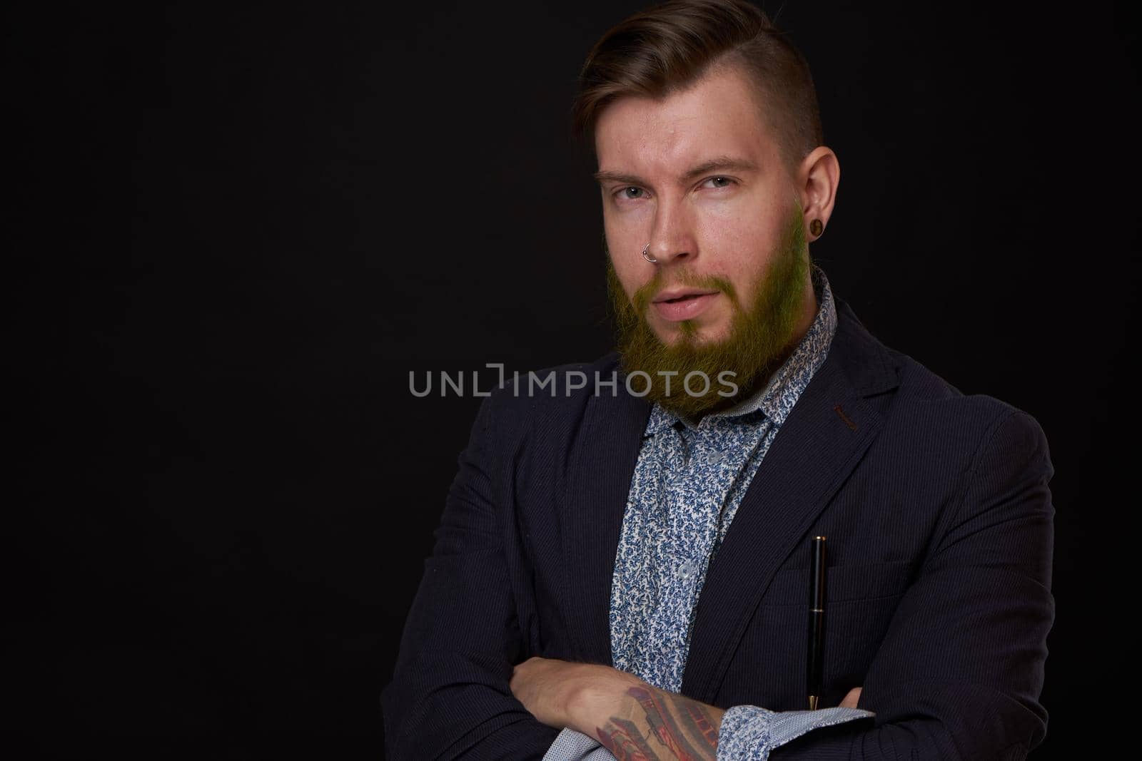 fashionable business man in a jacket with a beard posing by Vichizh