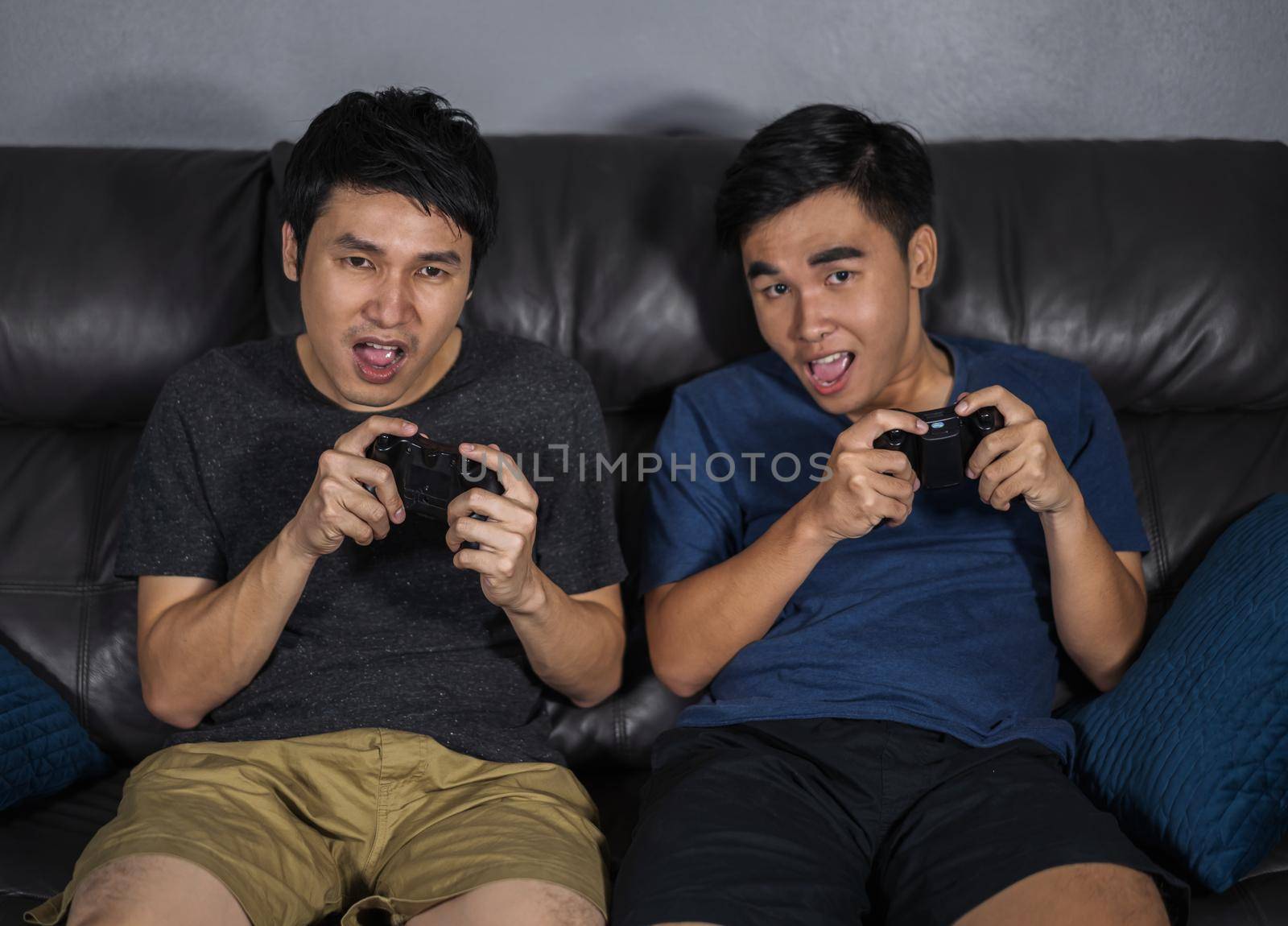 two happy man playing video games by geargodz