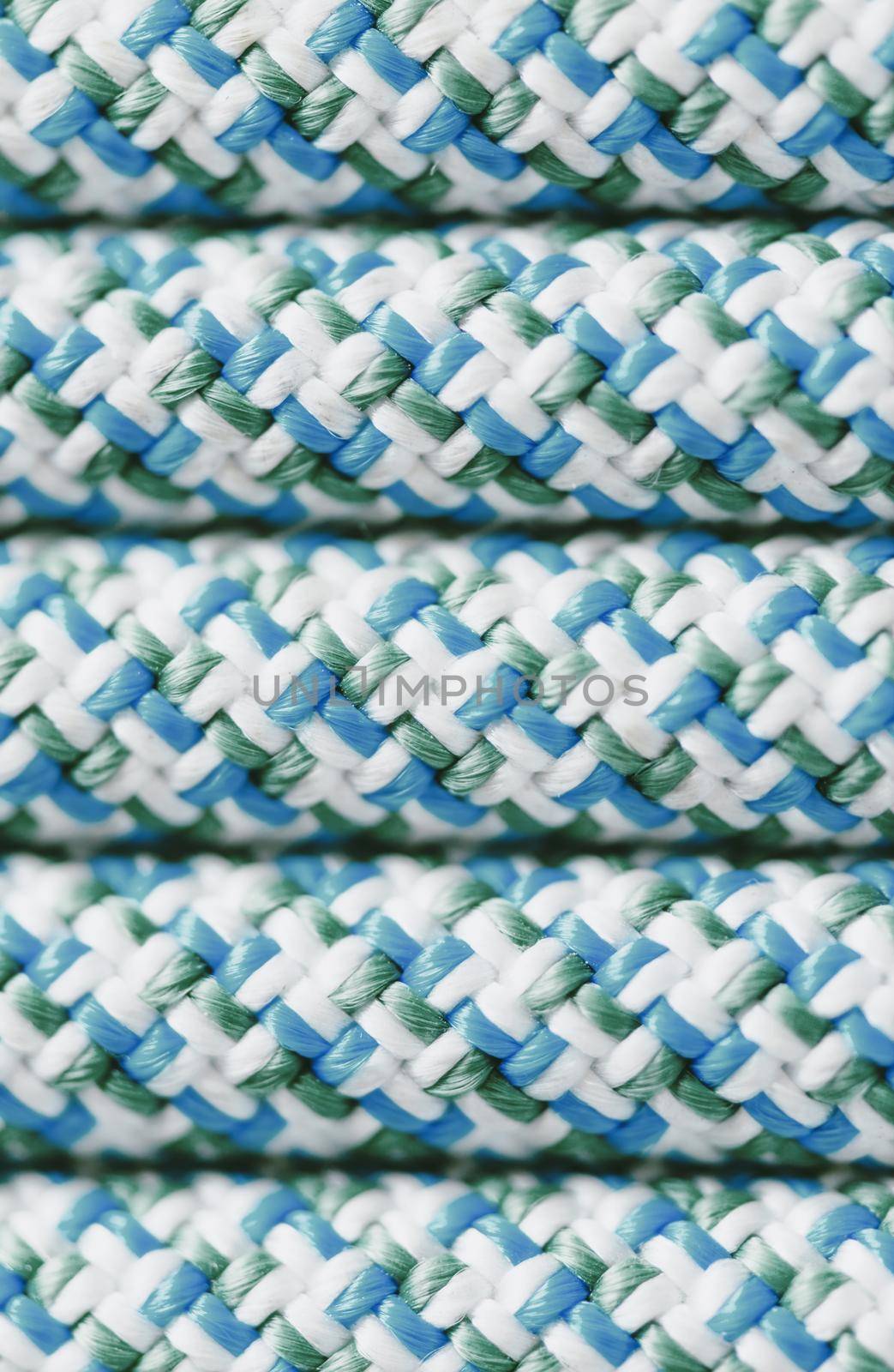 Close-up lines of climbing rope blue color, top view, texture.