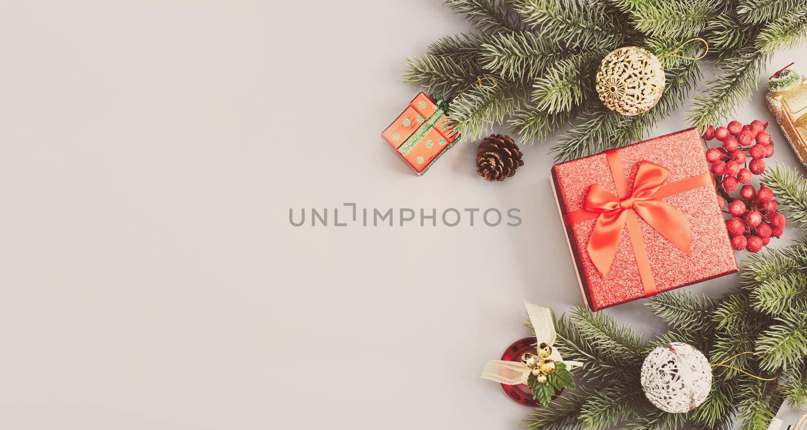 New Year background with Christmas balls and fir branches.  Abstract christmas lights on background.