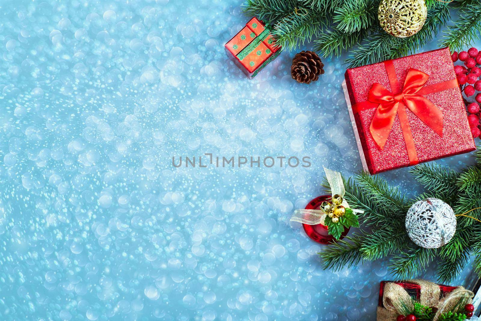 New Year background with Christmas balls and fir branches.  Abstract christmas lights on background.