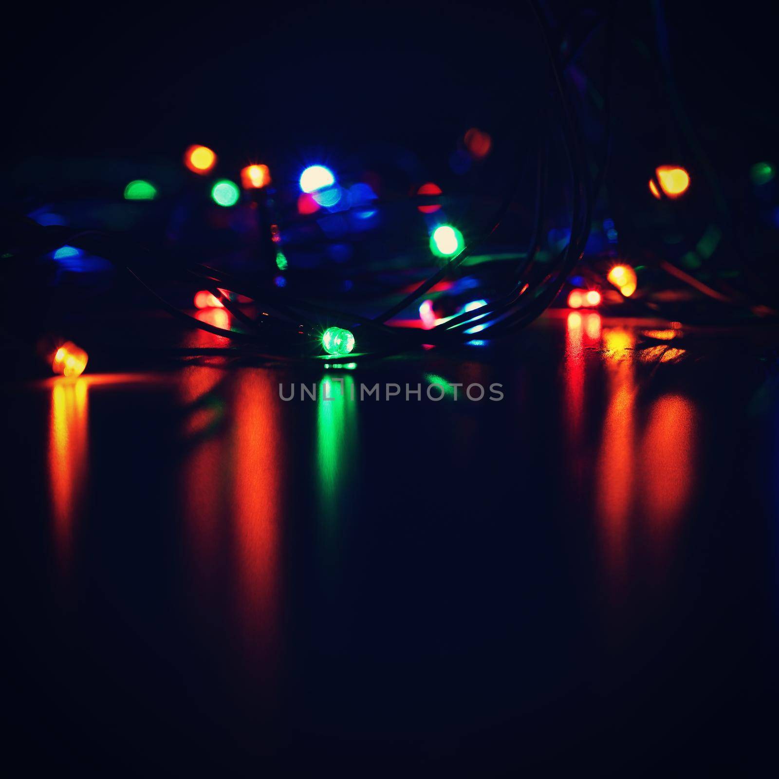 Christmas lights. Beautiful colorful abstract background with Christmas tree decorations. Concept for winter and holidays. 