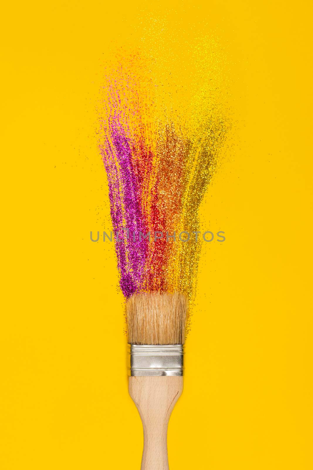 Pain brush and stroke or smear made of glossy sparkling glitter on bright yellow background. Vertical banner. Creative art concept