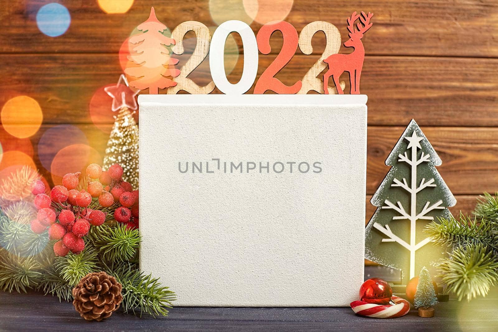 Christmas Decoration With Ornament And Defocused Lights , Christmas card with fir and decor on glitter background by Maximusnd