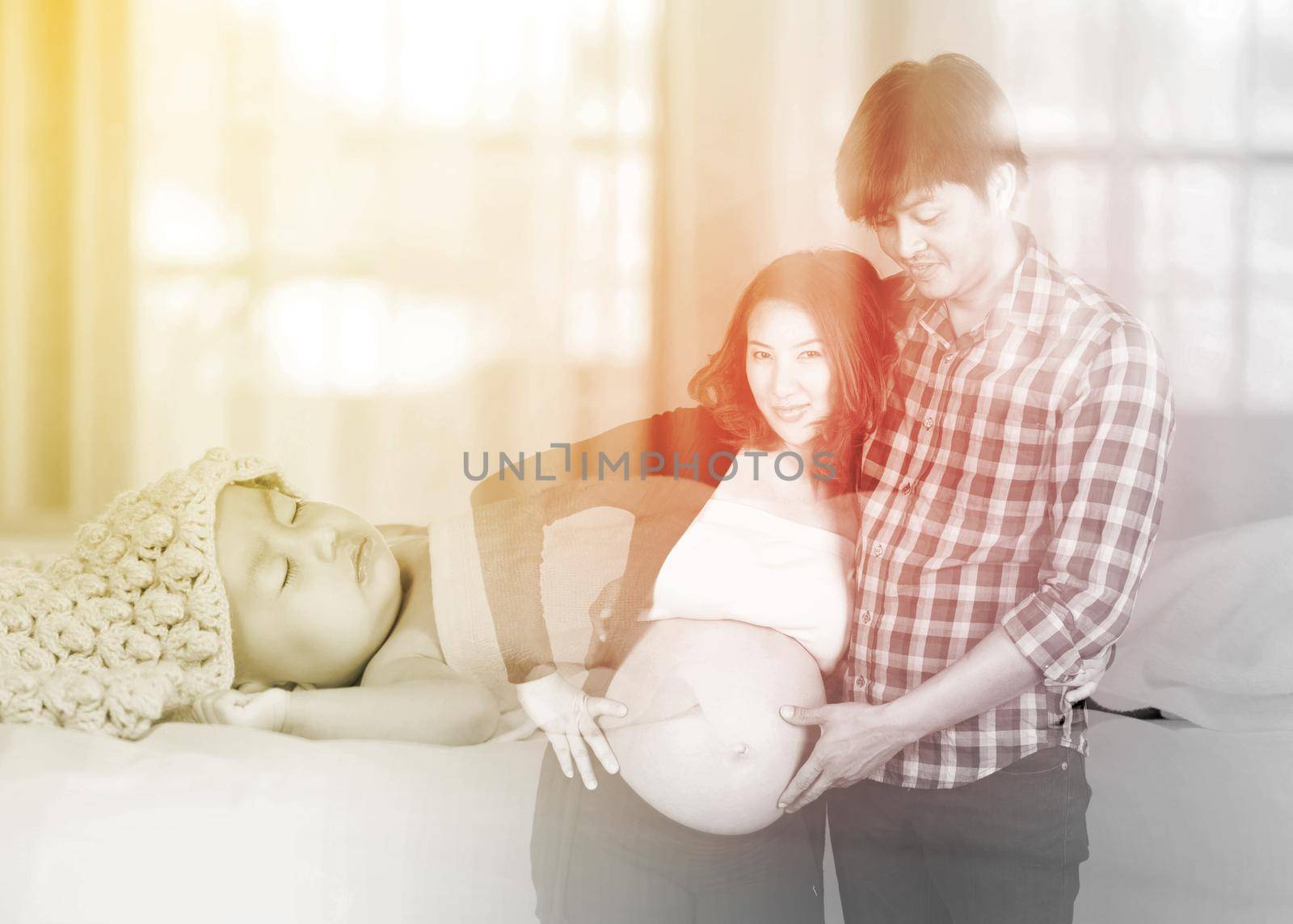 Double exposure of pregnant woman with husband and baby by geargodz