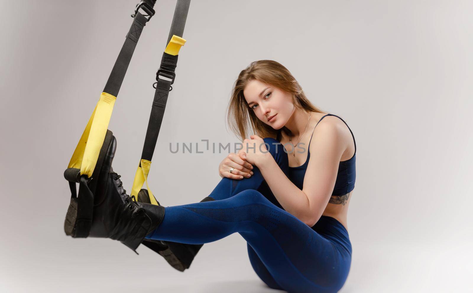 the girl on white background with TRX loops