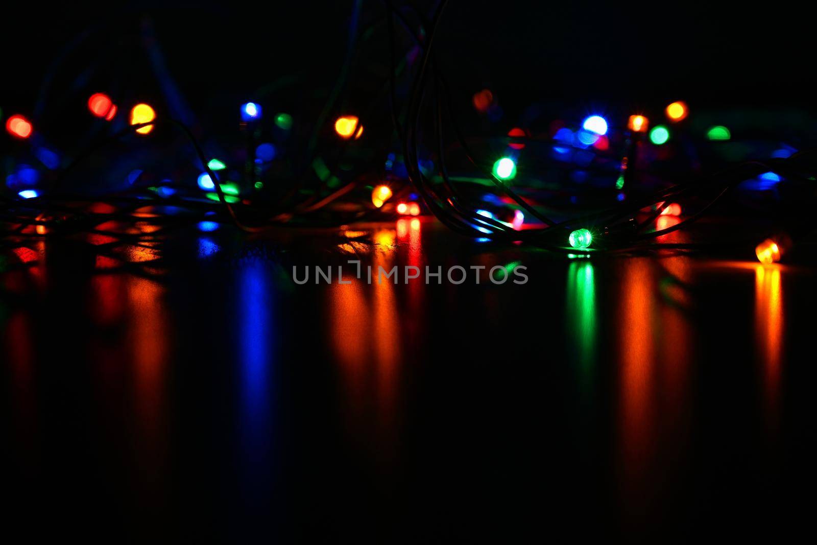 Christmas lights. Beautiful colorful abstract background with Christmas tree decorations. Concept for winter and holidays. 