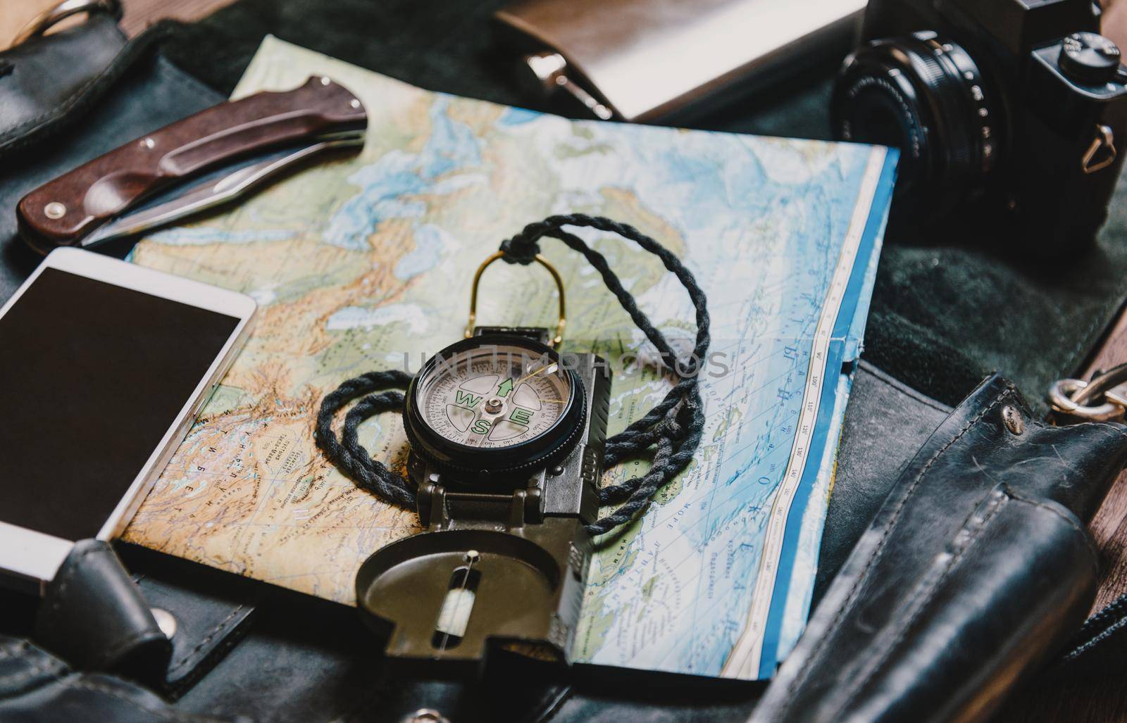 Equipment for tourism and travel. Map and compass.