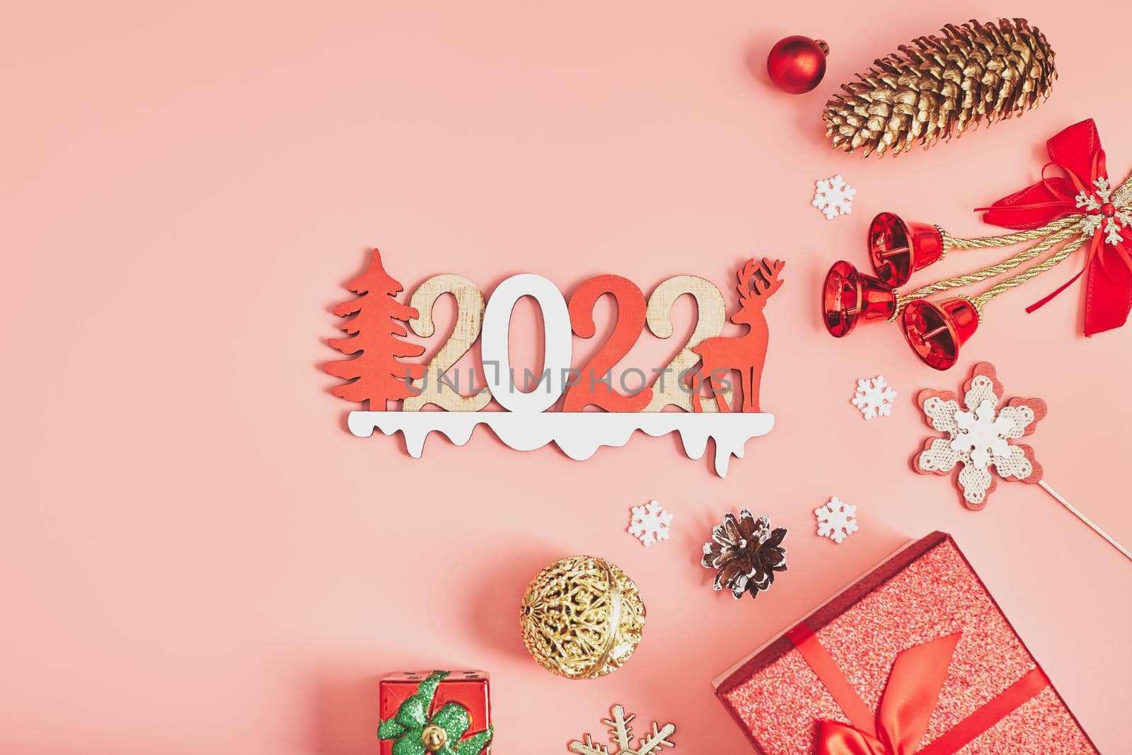 Happy New Year holiday concept. New Year decorations,  tree, snowflake, pine cone, gifts on  background. Holiday party greeting card mockup with copy space. Flat lay, top view, overhead.