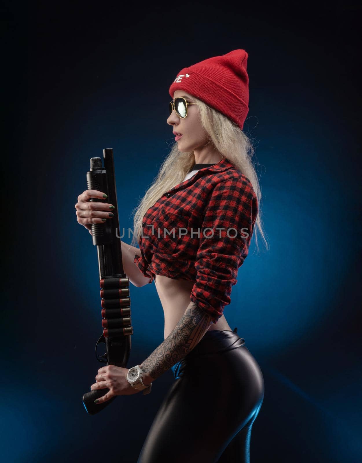 a bright blonde in a red hat with a shotgun on a dark background by Rotozey