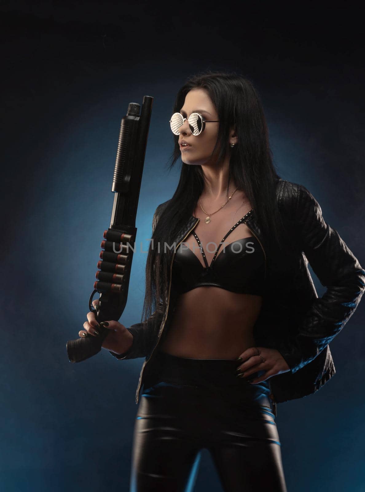 girl in a leather jacket with a shotgun by Rotozey