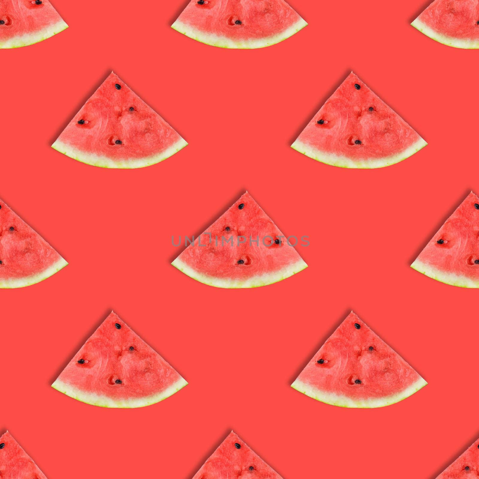 Flat layout of watermelon slices on pink or coral background. Watermelon seamless pattern. Summer fruit.