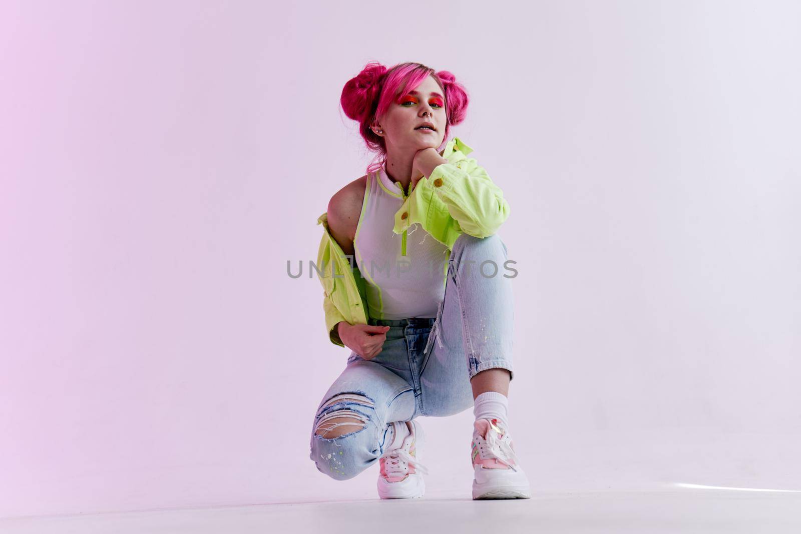 woman with pink hair teen fashionable clothes posing neon. High quality photo