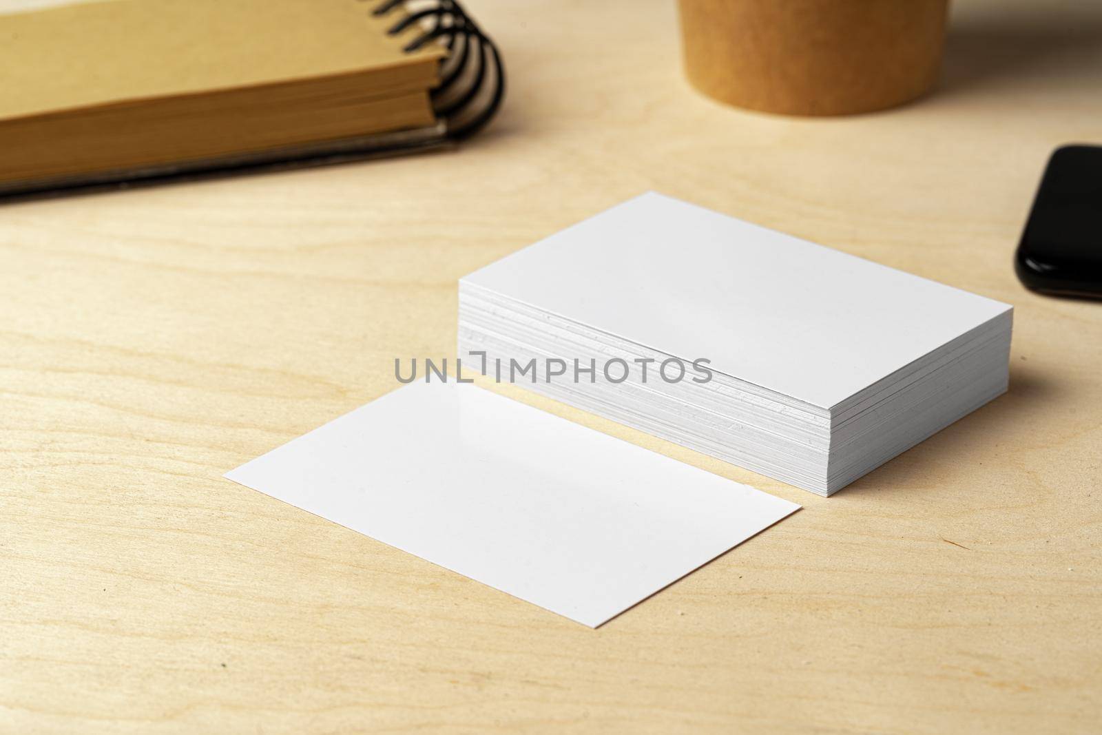 Two piles of blank business cards on table, close up