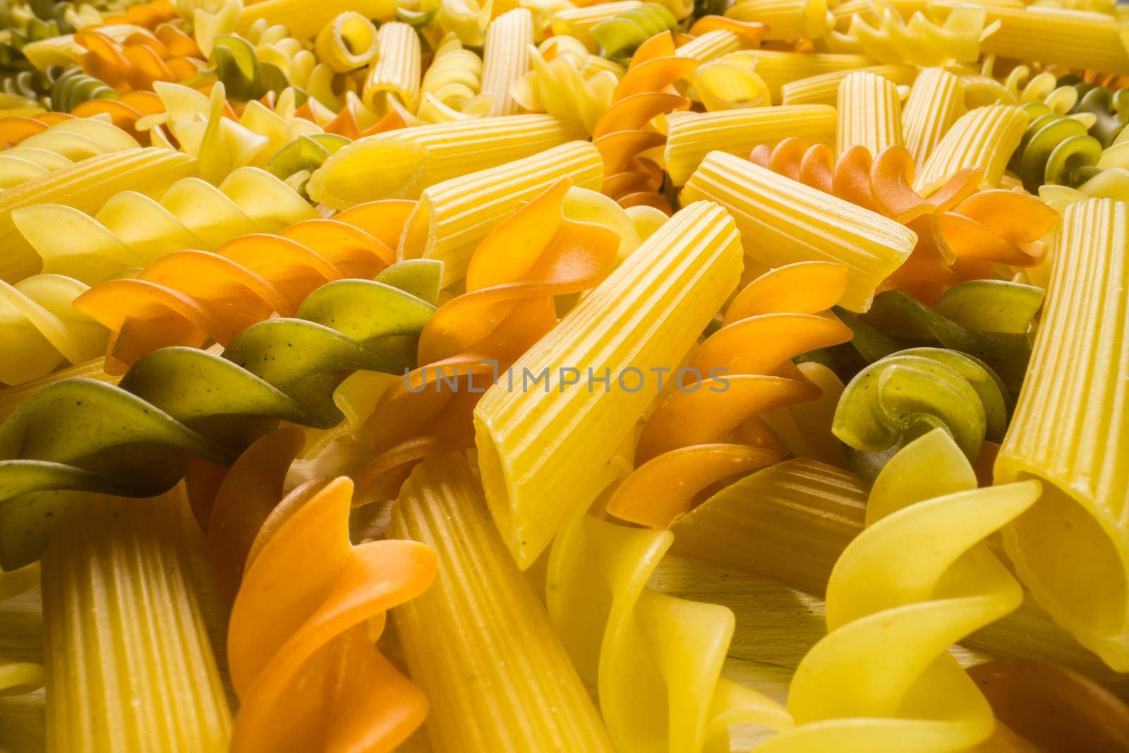Variety of types and shapes of dry Italian pasta close-up. Food and traditional cuisine. by Satura86