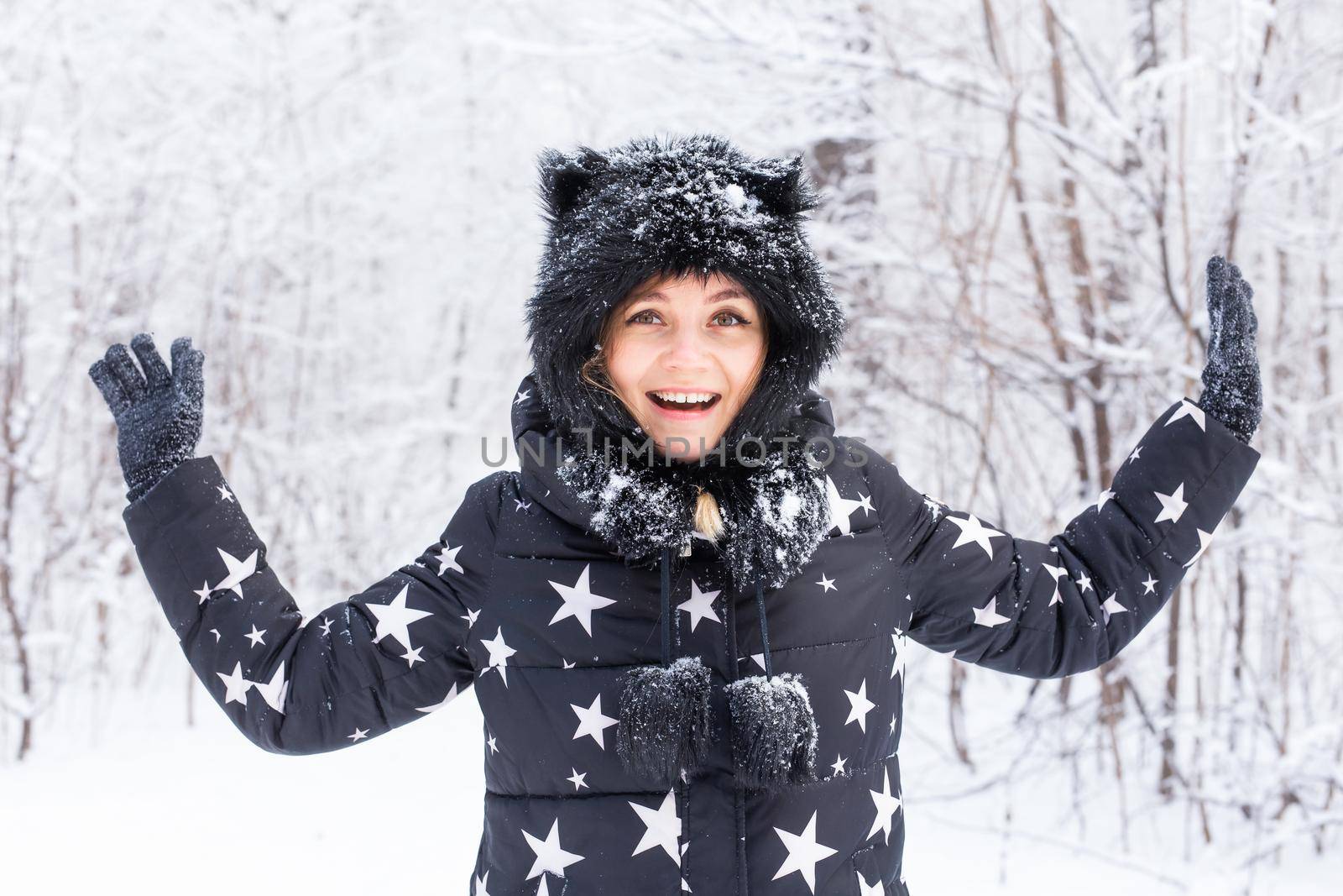 Beautiful young woman winter snowy outdoor portrait