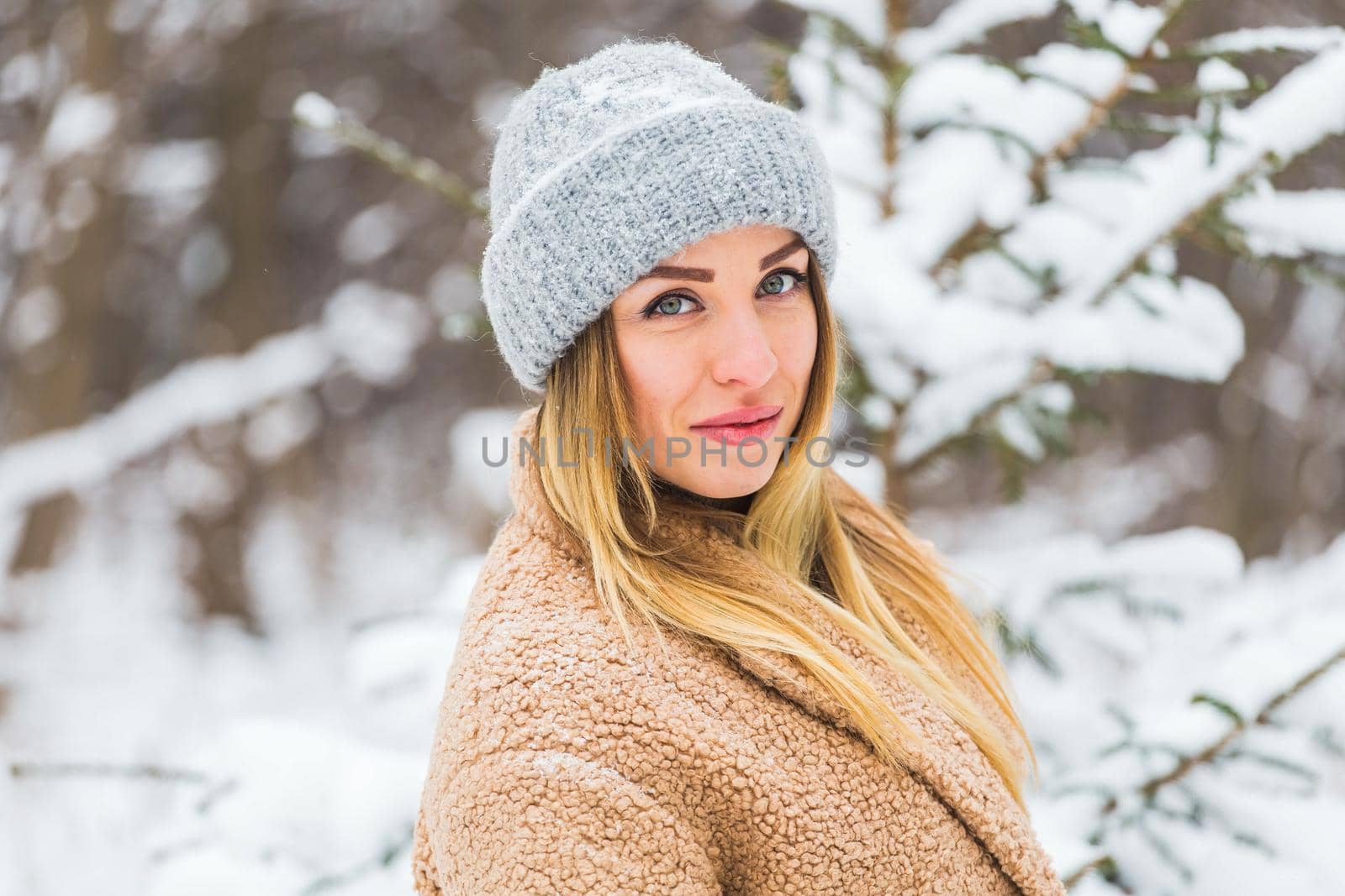 Attractive young woman in winter time outdoor. Snow, holidays and season concept. by Satura86