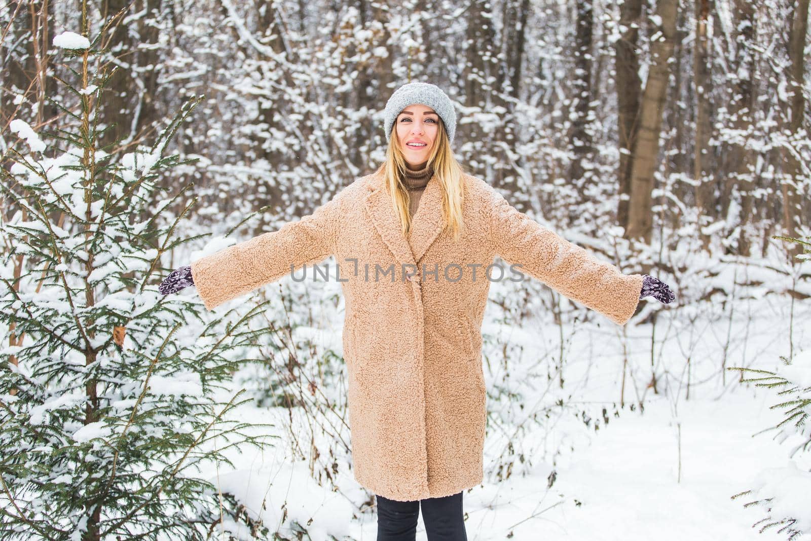 Attractive young woman in winter time outdoor. Snow, holidays and season concept. by Satura86