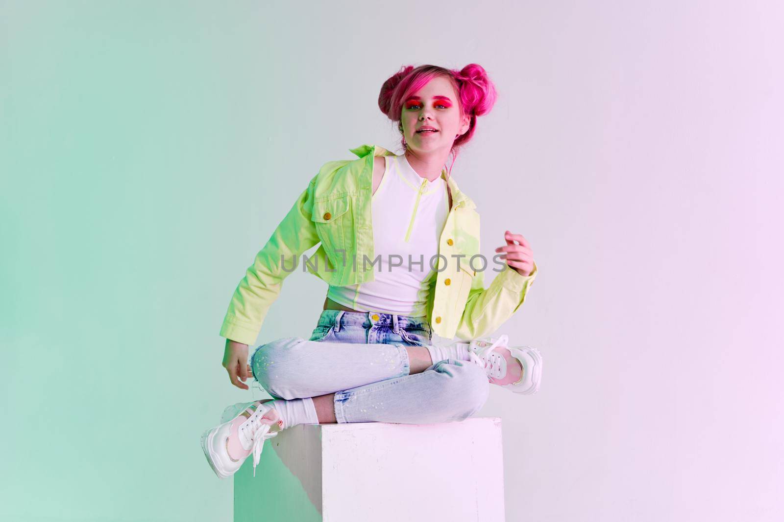 cheerful woman green jacket fashionable clothes studio model. High quality photo