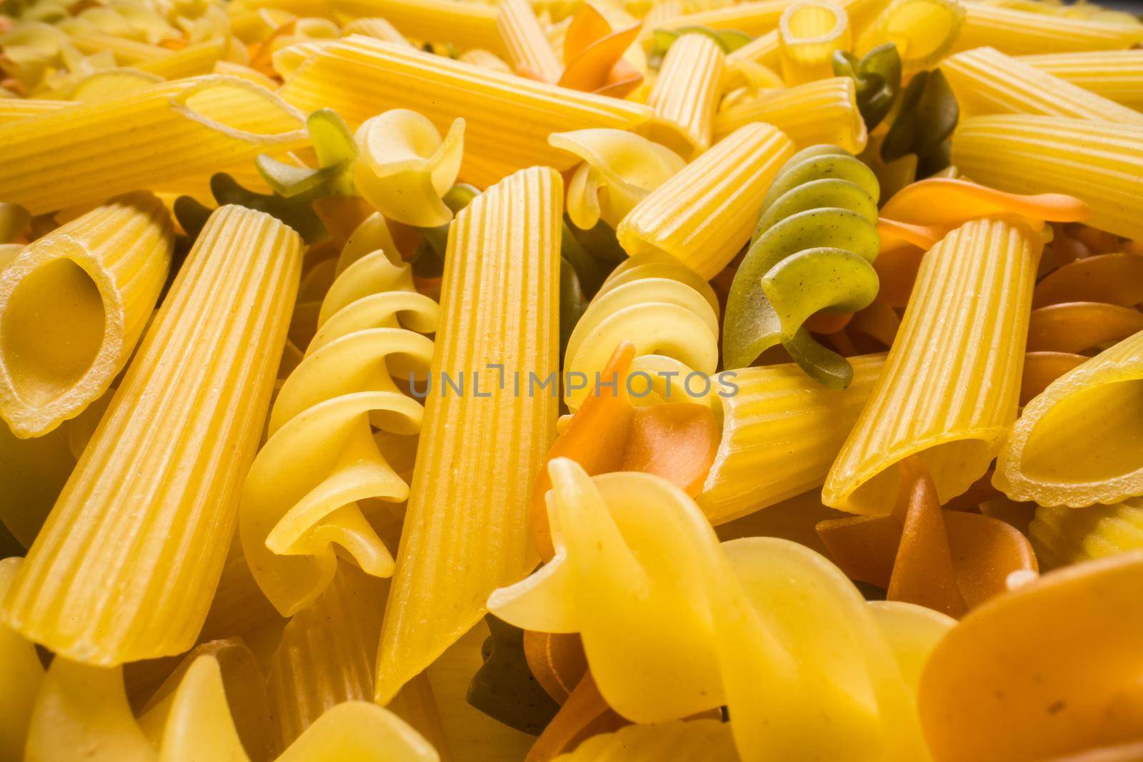 Variety of types and shapes of dry Italian pasta close-up. Food and traditional cuisine. by Satura86