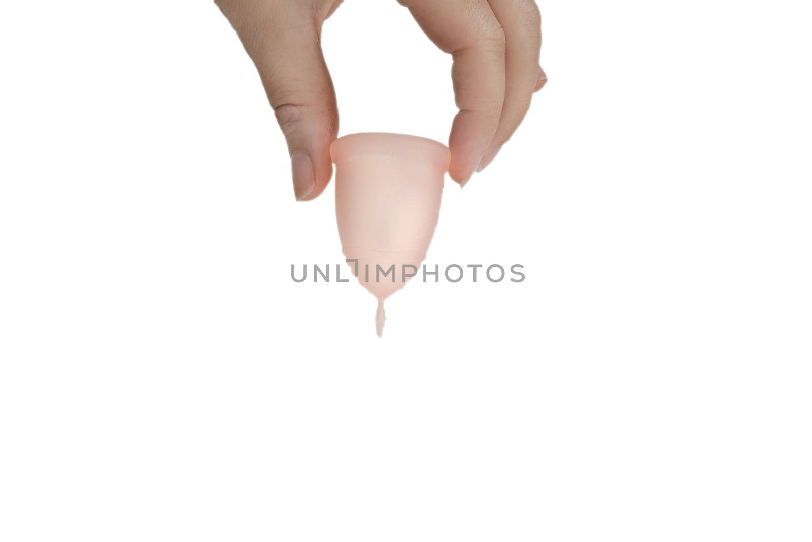 Womans hand holding menstrual cup, period cup isolated on white background with copy space, alternative product zero waste eco friendly closeup