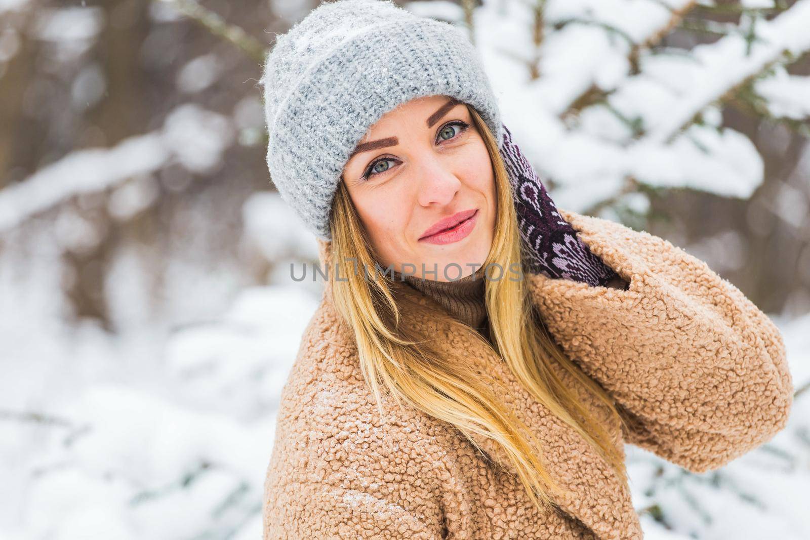 Beautiful winter portrait of young woman in the winter snowy scenery by Satura86