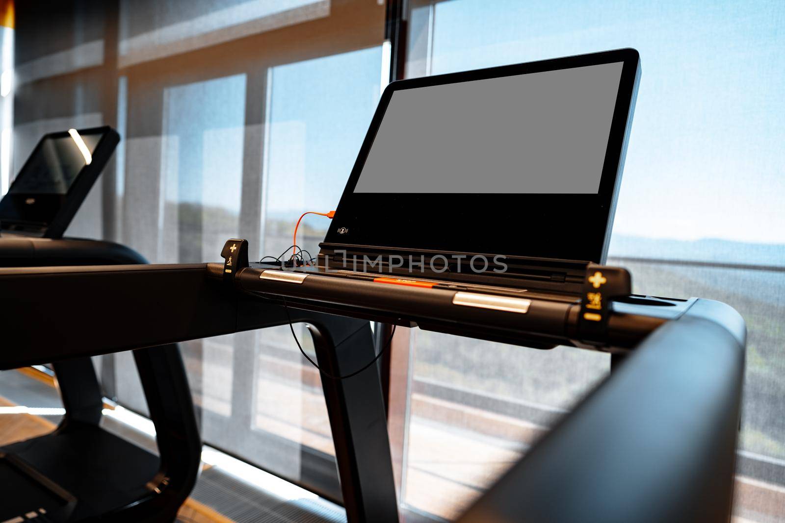 Studio shot of a professional treadmill in a modern gym