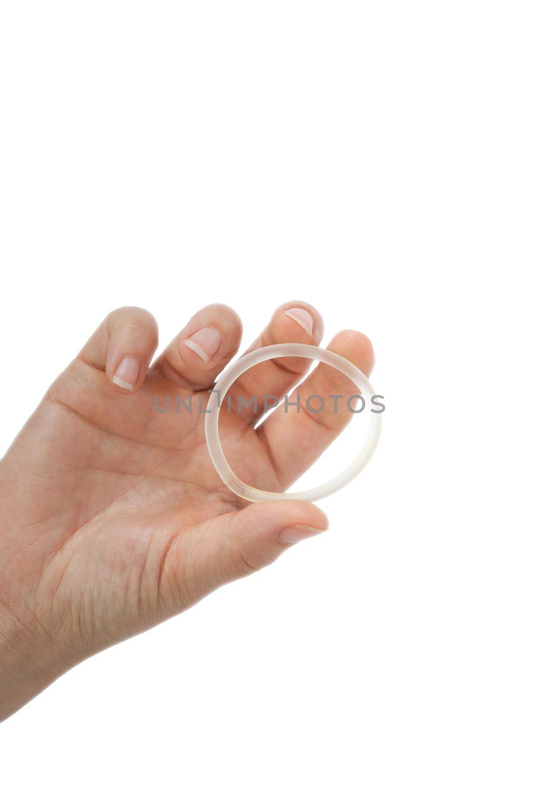 Birth control ,hormone, contraception ring in a womans hand isolated on white background, vaginal ring for contraceptive use with copy space by Annebel146