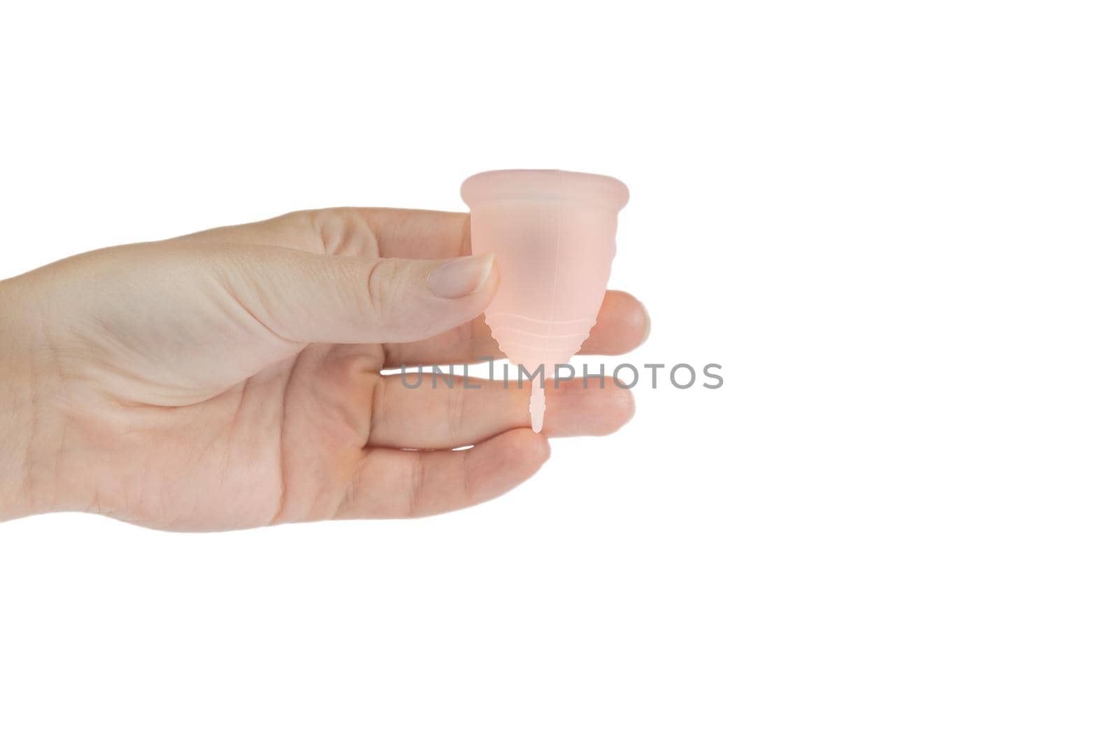 Womans hand holding menstrual cup, period cup isolated on white background with copy space, alternative product zero waste eco friendly closeup