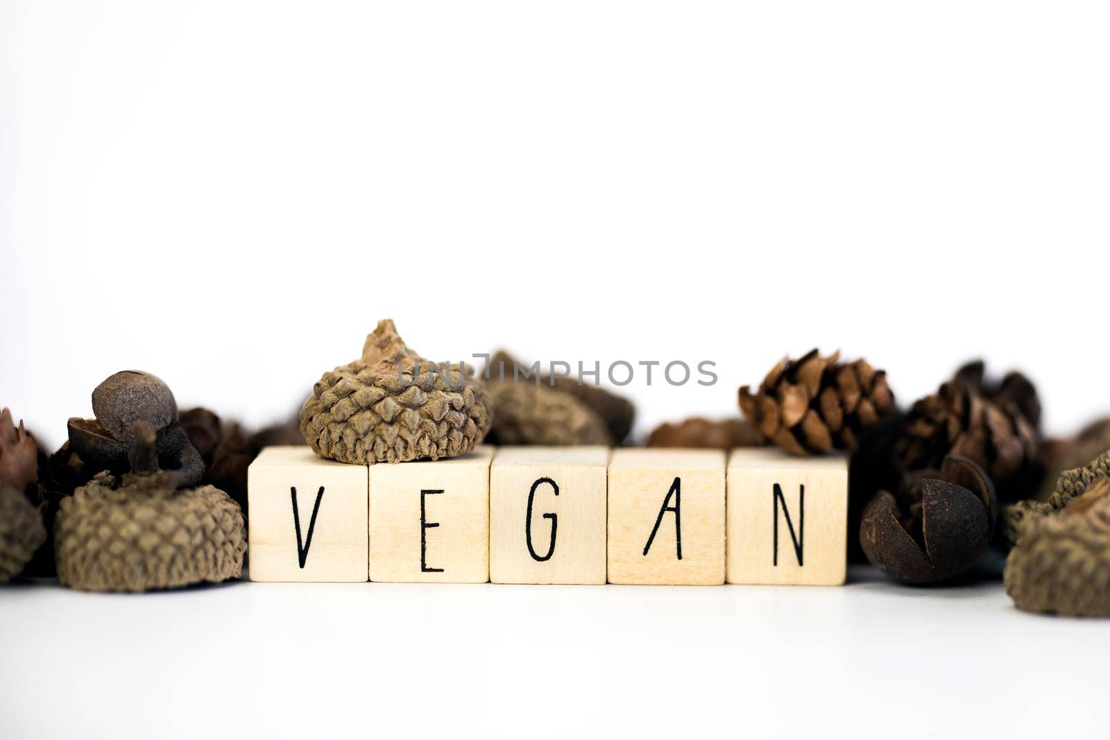 Vegan concept and veganism lifestyle, Vegan text on white background eating green biological natural food with copy space closeup