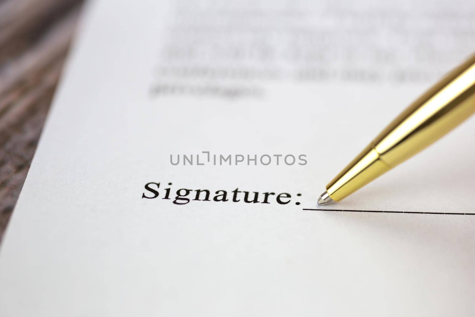 Signing a contract with signature with gold pen macro close-up, businessman,contract,deal,concept background by Annebel146