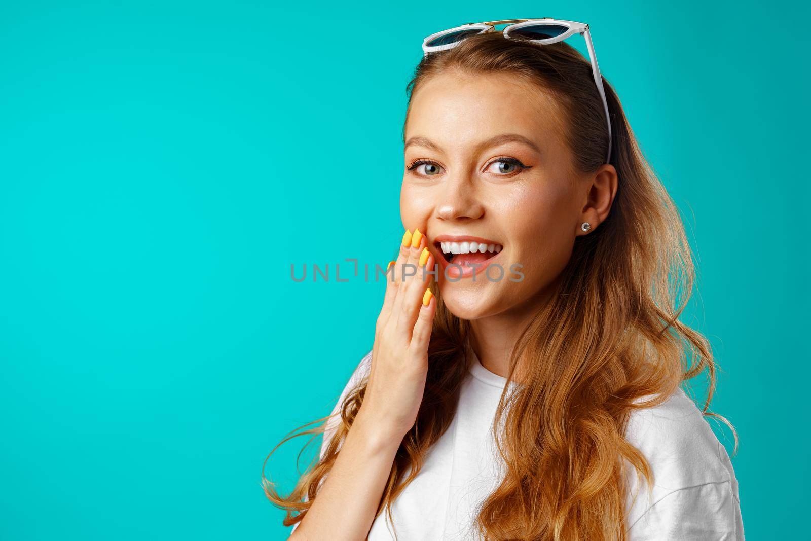 Young attractive cheerful girl laughing with joy close up