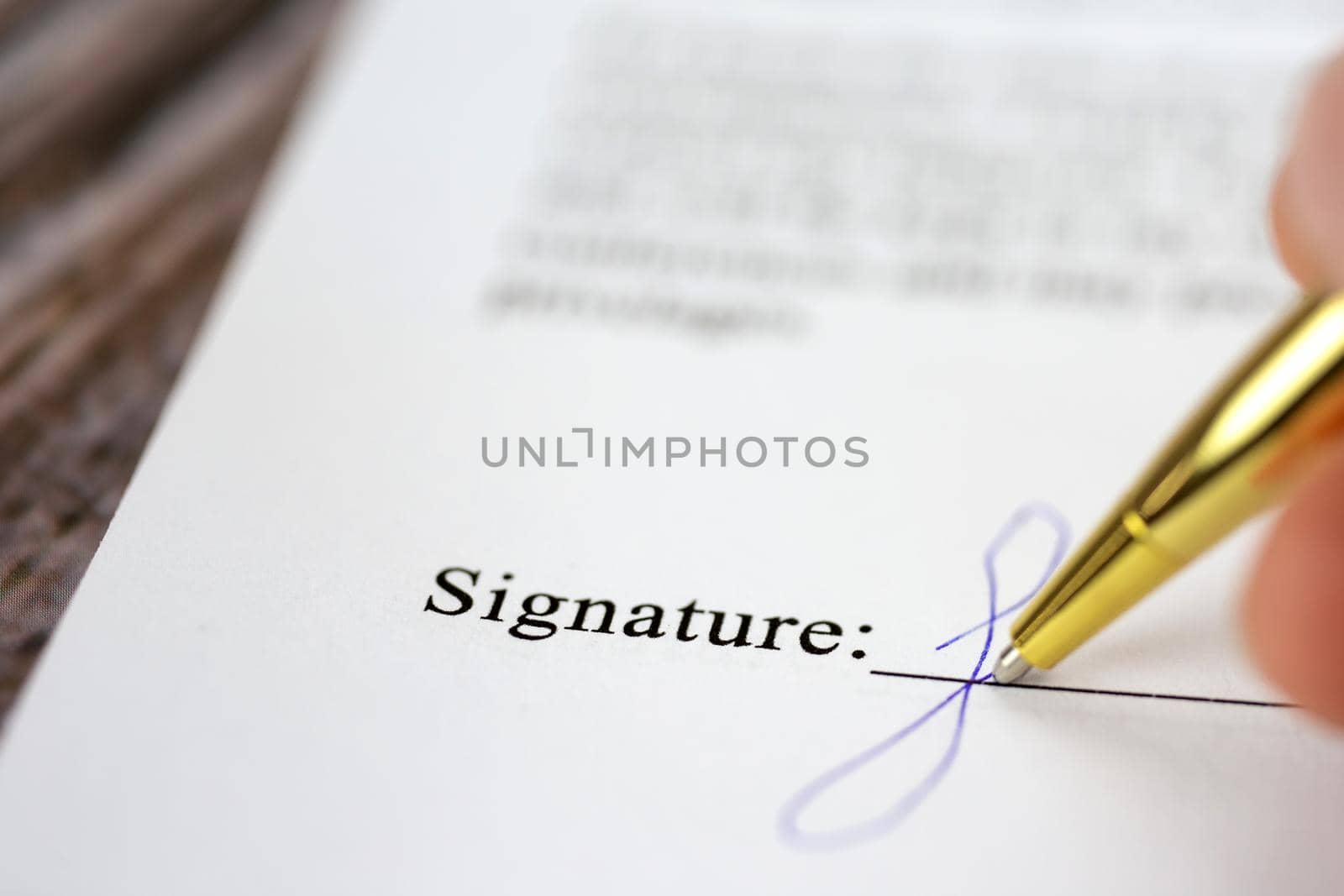 Signing a contract with signature with gold pen macro close-up, businessman,contract,deal,concept background by Annebel146