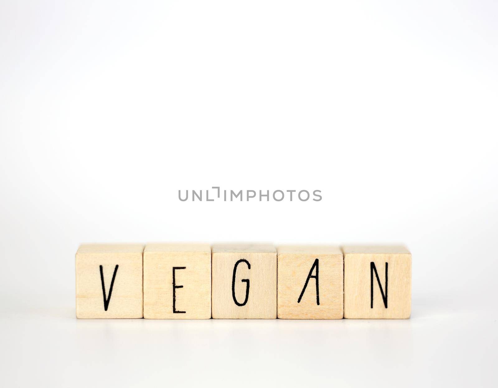 Vegan and hashtag written with wooden cubes and nature decoration isolated on white background with copy space, vegan,vegetarian,health concept background modern design natural style by Annebel146