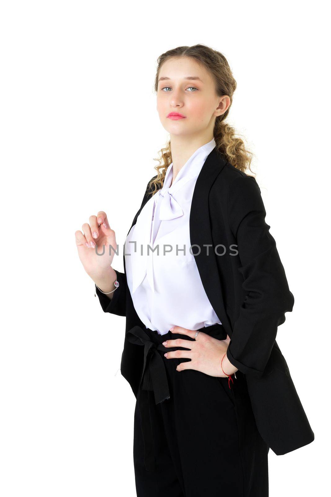 Stylish, model girl, student, in a strict black suit. Portrait of attractive emotional young business woman in black jacket and white blouse looking at camera while standing against isolated white background