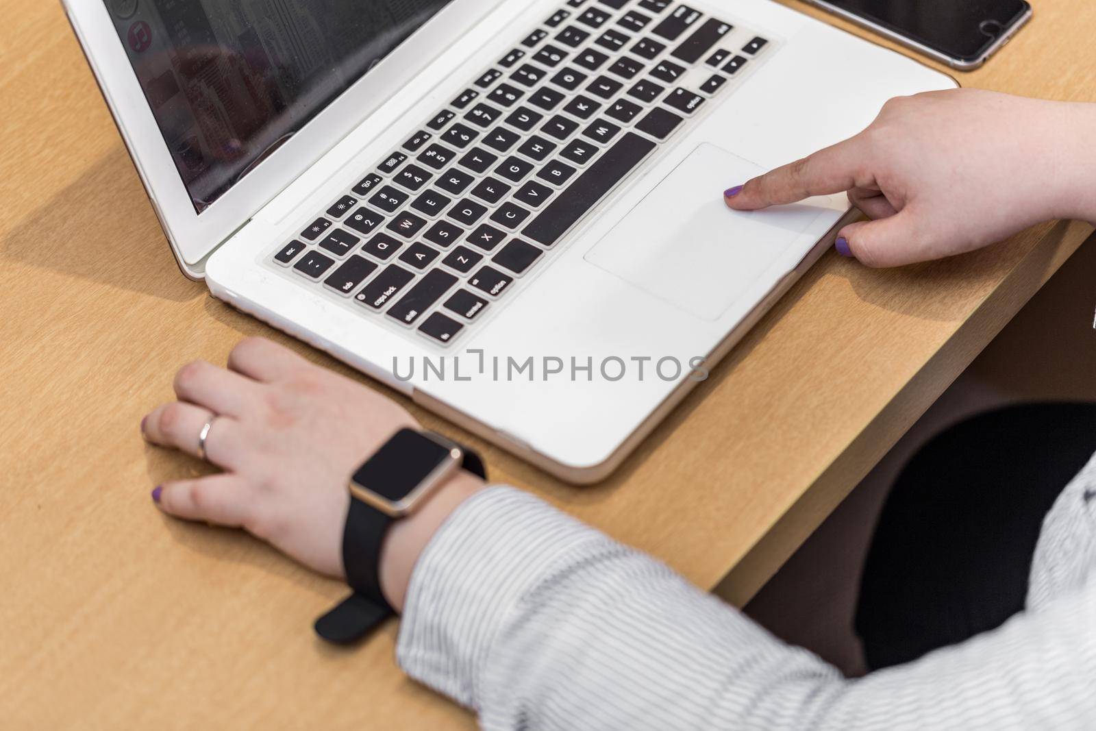 set of modern computer devices - laptop, watch and phone close up