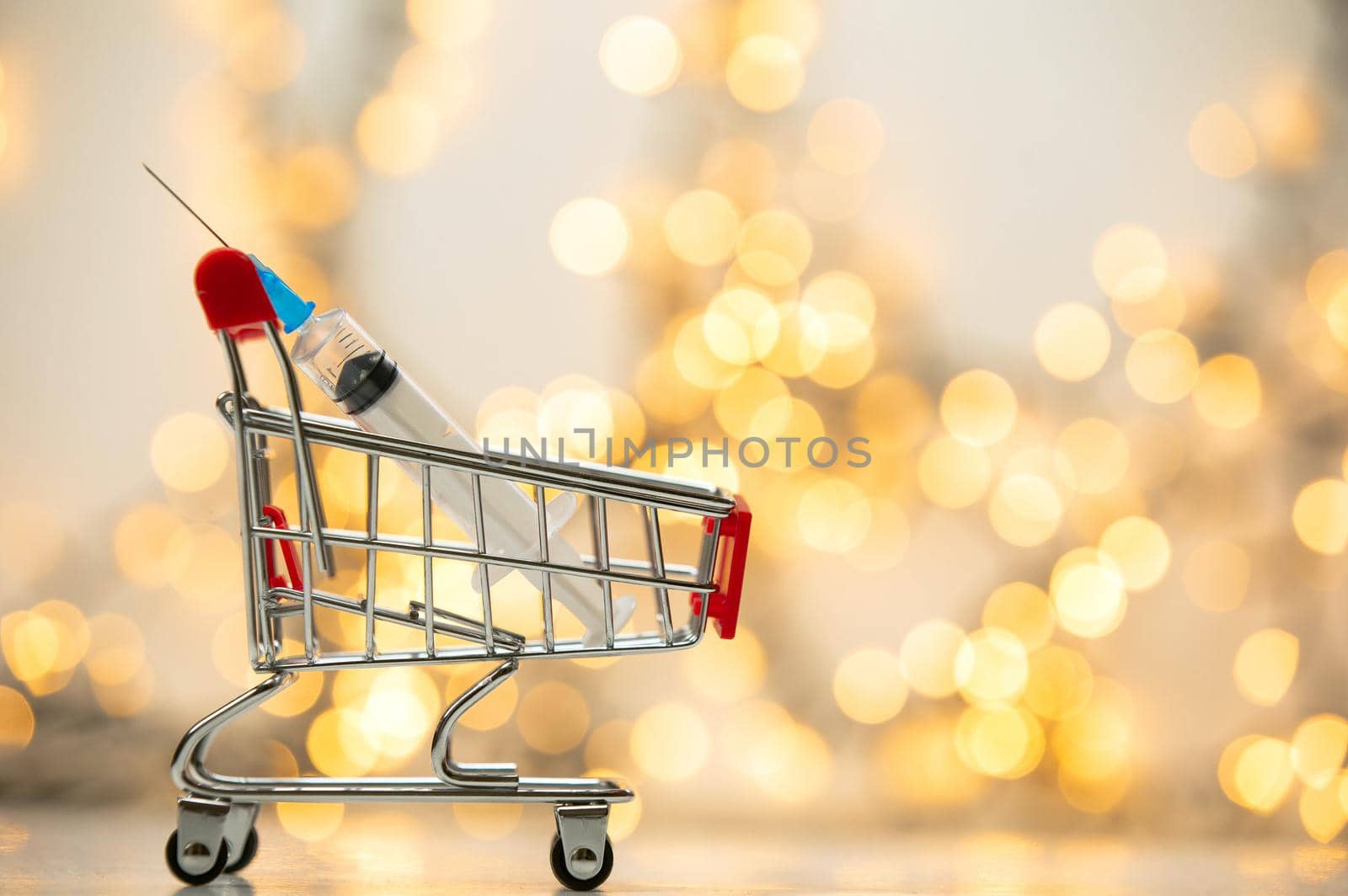 syringe injection in shopping cart for coronavirus vaccine disease, covid-19 or other virus, vaccination shot, medicine and drug concept bokeh background health