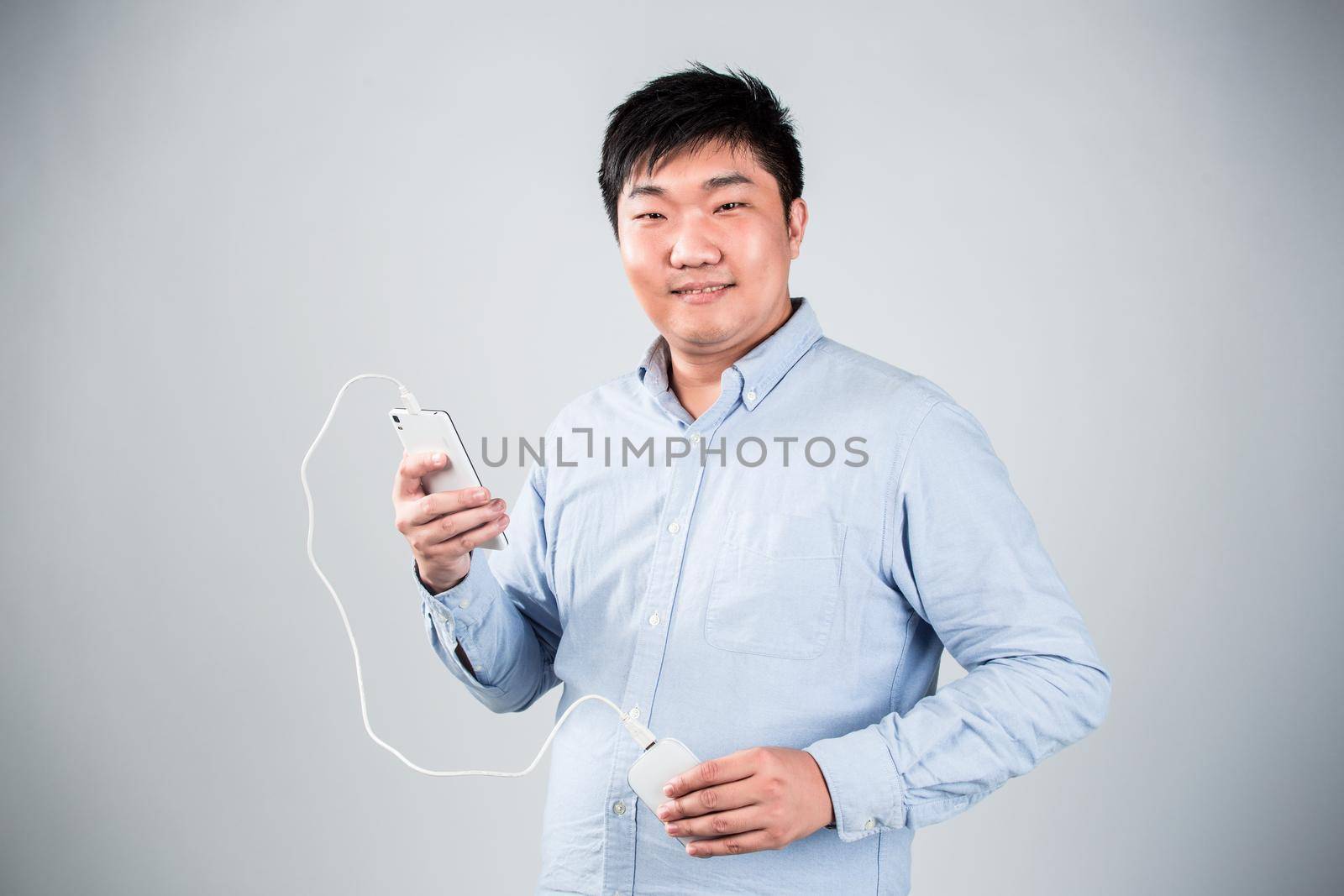 man is charging smartphone good