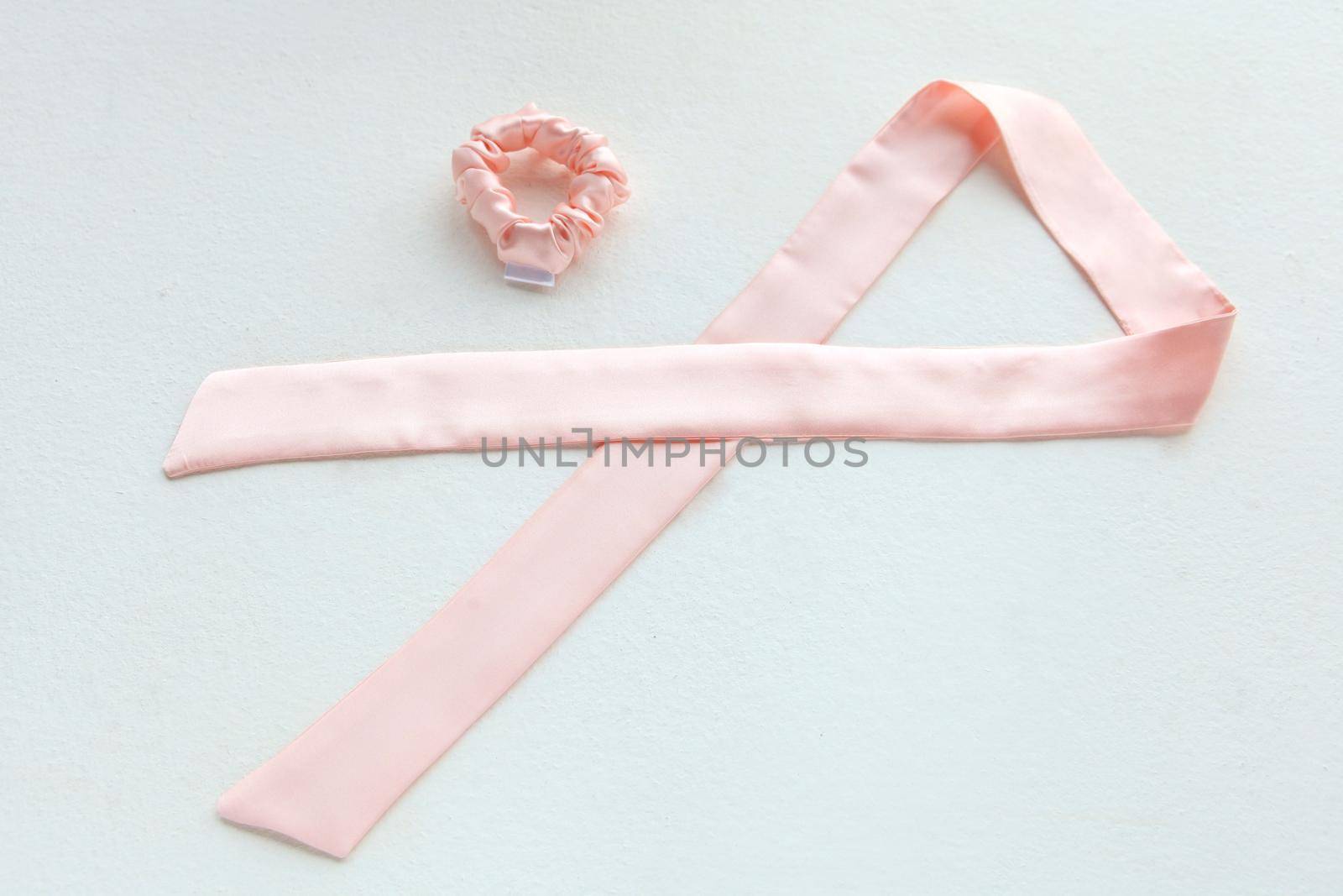 pink silk Scrunchy isolated on white. Flat lay Hairdressing tools and accessories as Color Hair Scrunchies, Elastic Hair Bands, Bobble Sports Scrunchie Hairband