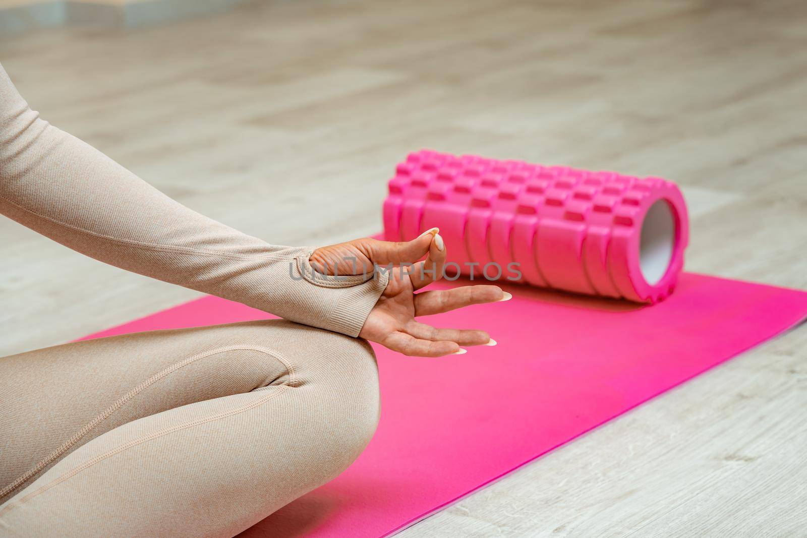 Close up hand and half body of healthy woman sit in lotus Yoga position.Young healthy woman sitting posture exercise in home.Concept of meditating,lifestyle and relaxation. by Matiunina