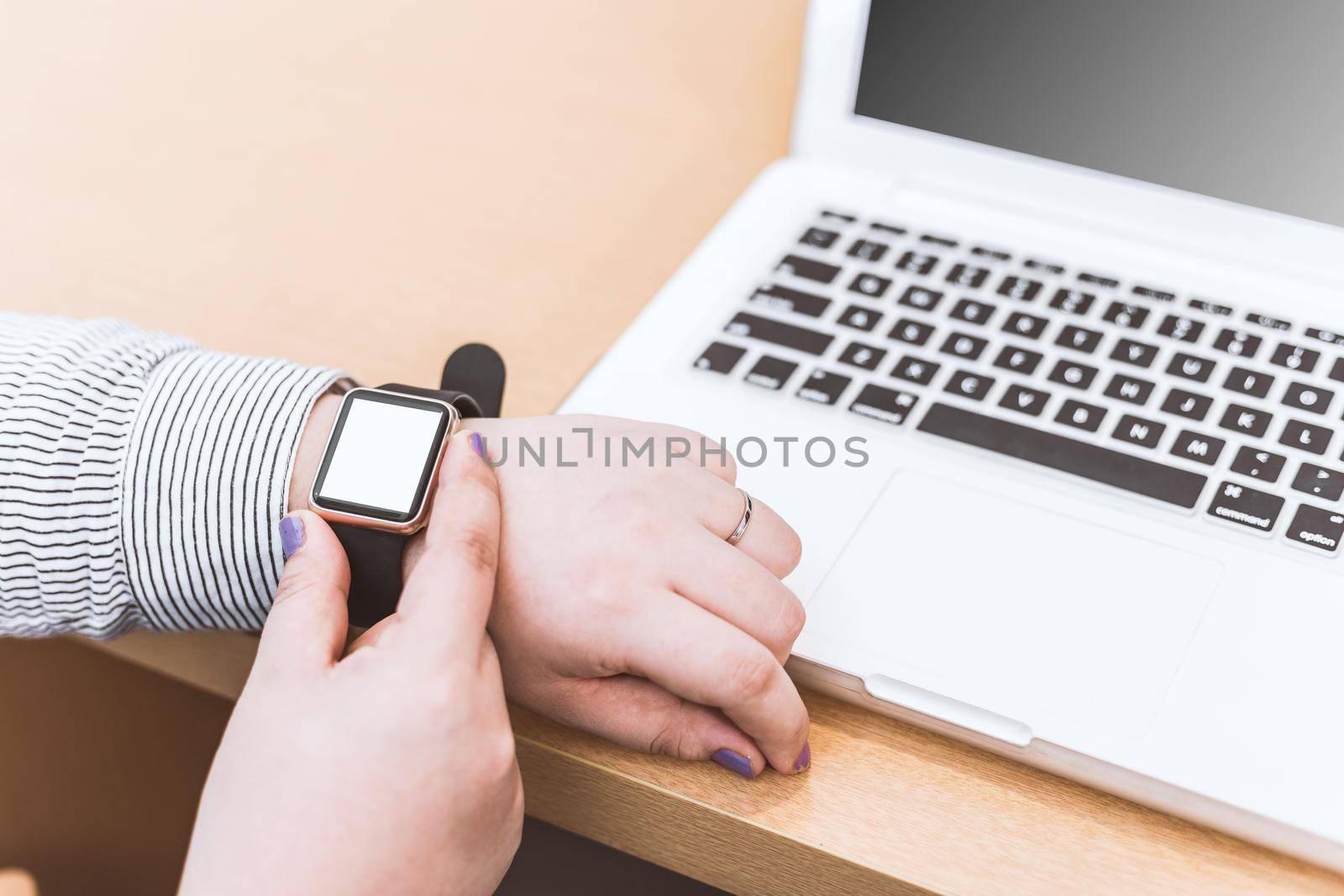 set of modern computer devices - laptop, watch and phone close up