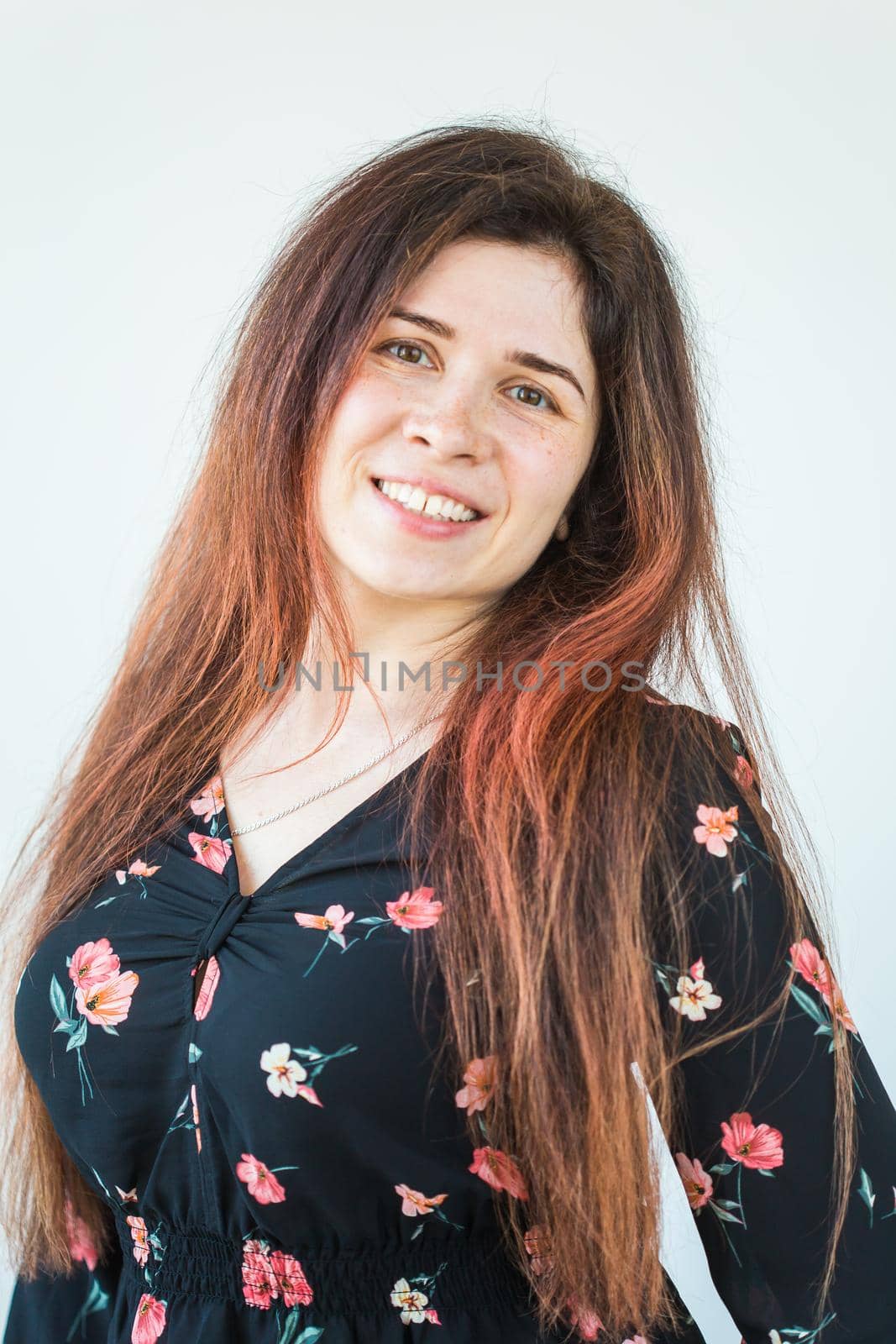 Playful and happy funny redhead woman having fun laughing on a white background. by Satura86