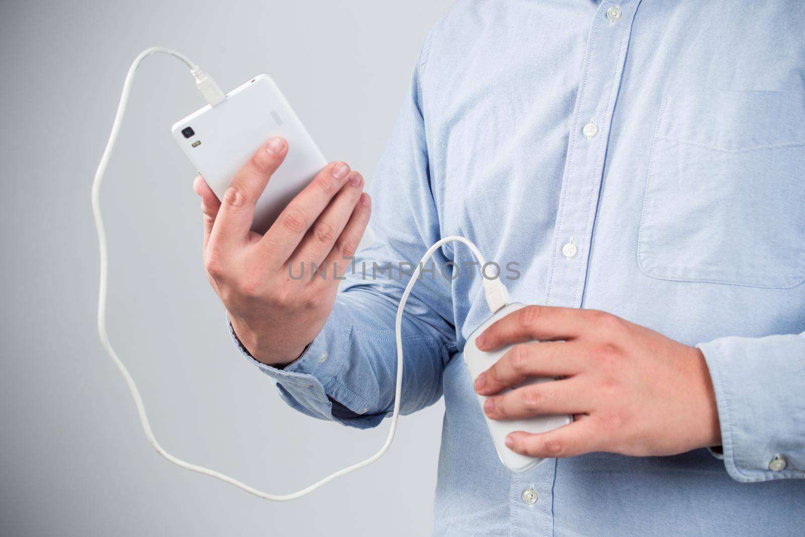 man is charging smartphone good