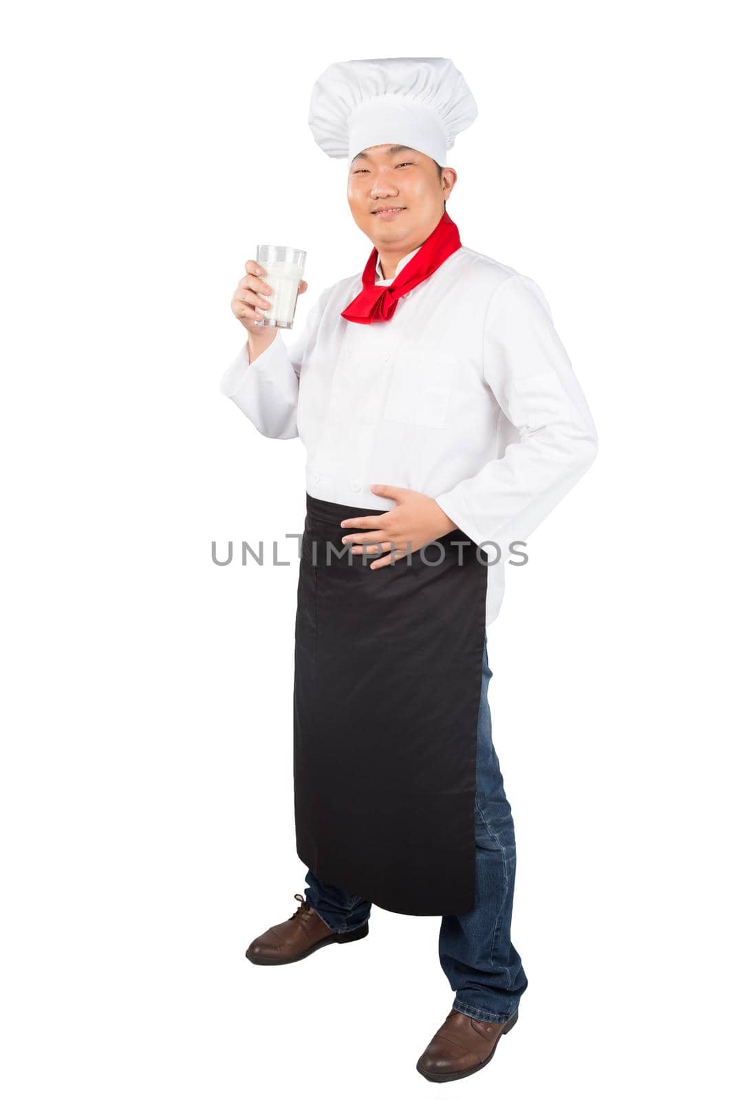 chef holding glass cup and drink yogurt or milk nice photo